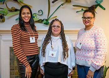 DRN director Deborah Johnson (center) smiles alongside two fellow DRN members, Dr. Ruth Nicole Brown and Dr. Terah Chambers. 