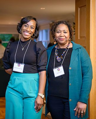 Dr. Ashlee Barnes-Lee and Dr. Emilie Smith, both MSU faculty members and DRN members smile for the camera.