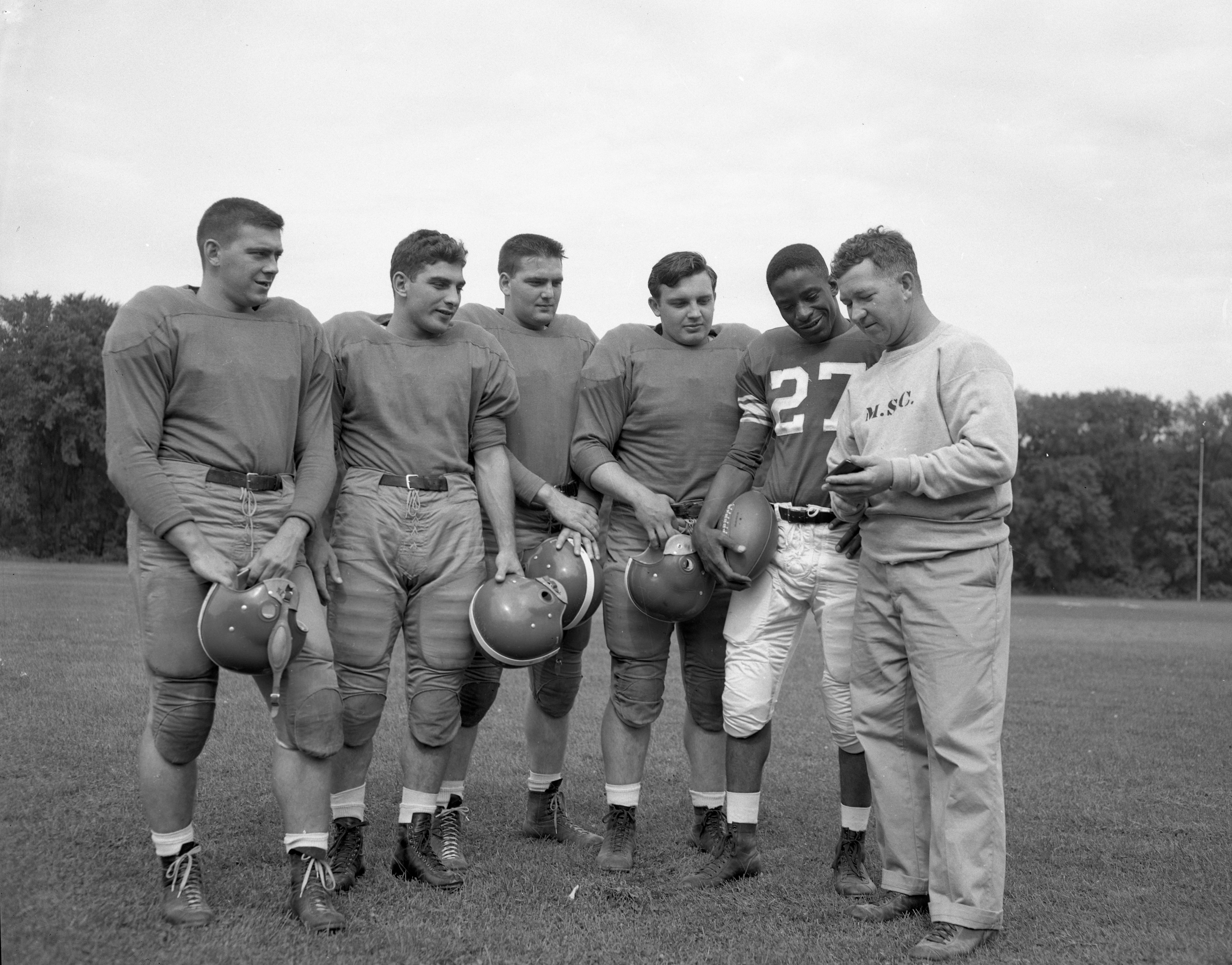Sept. 1950, a group of sophomore football players from Pennsylvania. L to R: Renaldo Kozikowski, Vincent Pisano, Richard Tamburo, Bill Horrell, #27 Willie Thrower and Line Coach Duffy Daugherty.