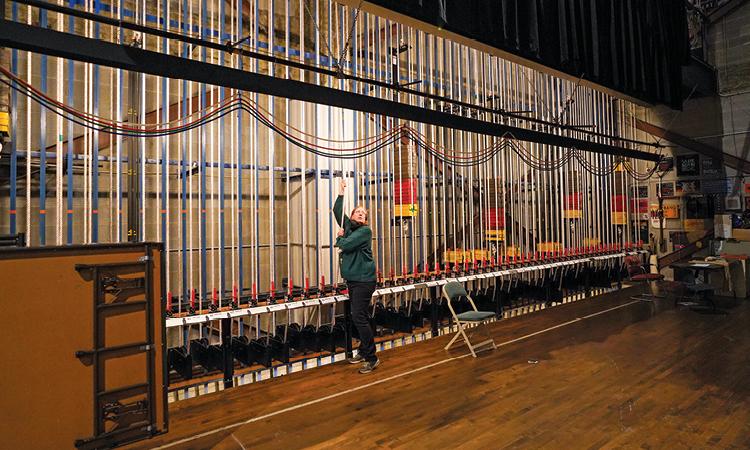 Cobb Great Hall’s rigging system. A dizzying array of ropes and pulleys allow operators to control curtains and scenery quickly and quietly. Stagehands communicate cues using lights that can only be seen backstage.