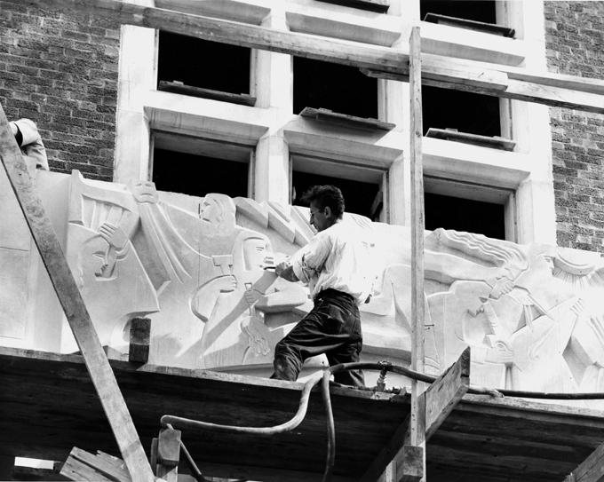 A sculptor works on the Union's facade, 1948. 