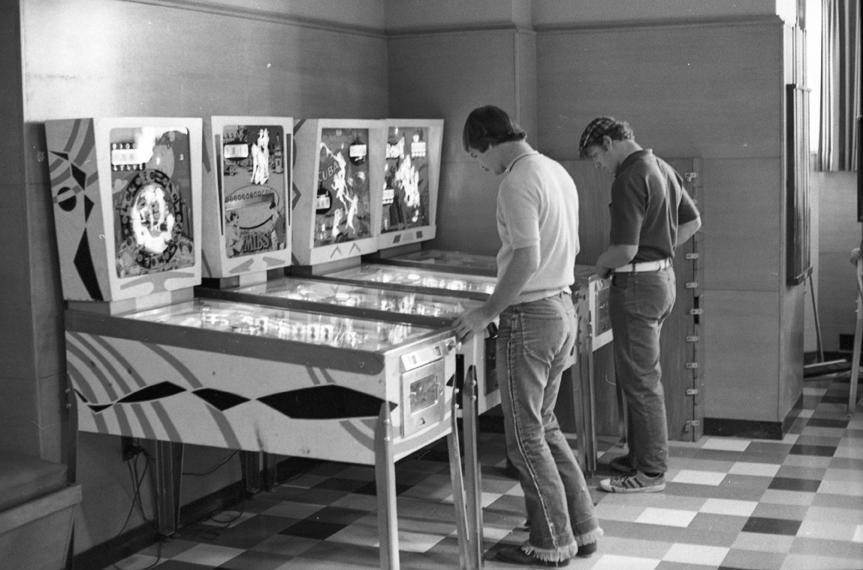 Playing pinball, 1971.