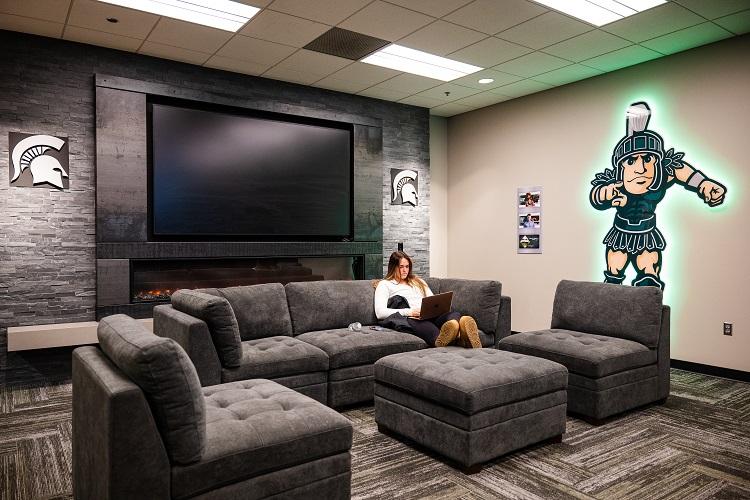 Track and field athlete Haley Guerrant relaxes in the student-athlete lounge.