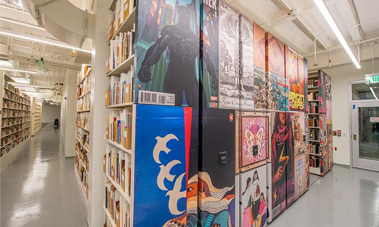 Bookshelves decorated with colorful murals.