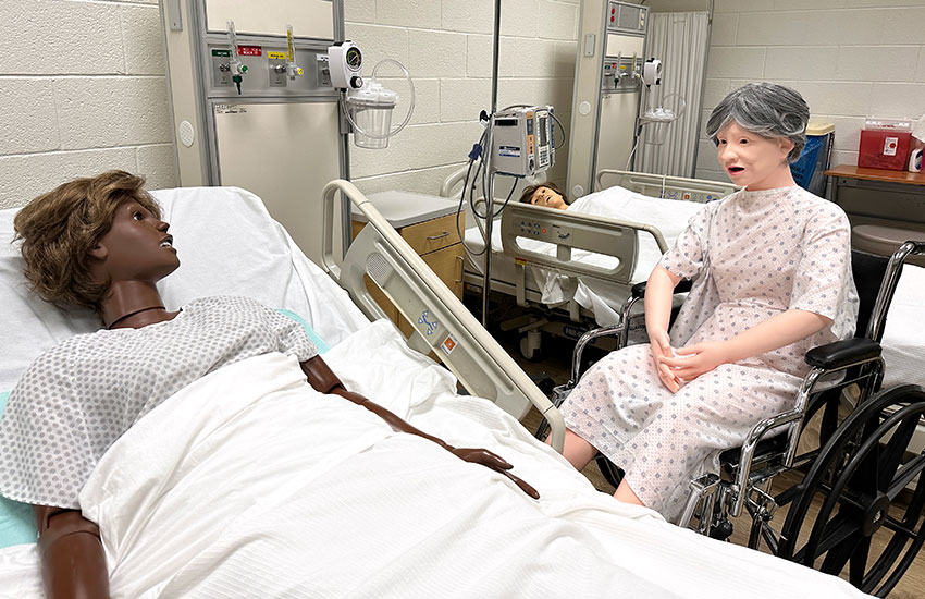 photo of the nursing simulation lab, featuring robots that resemble humans