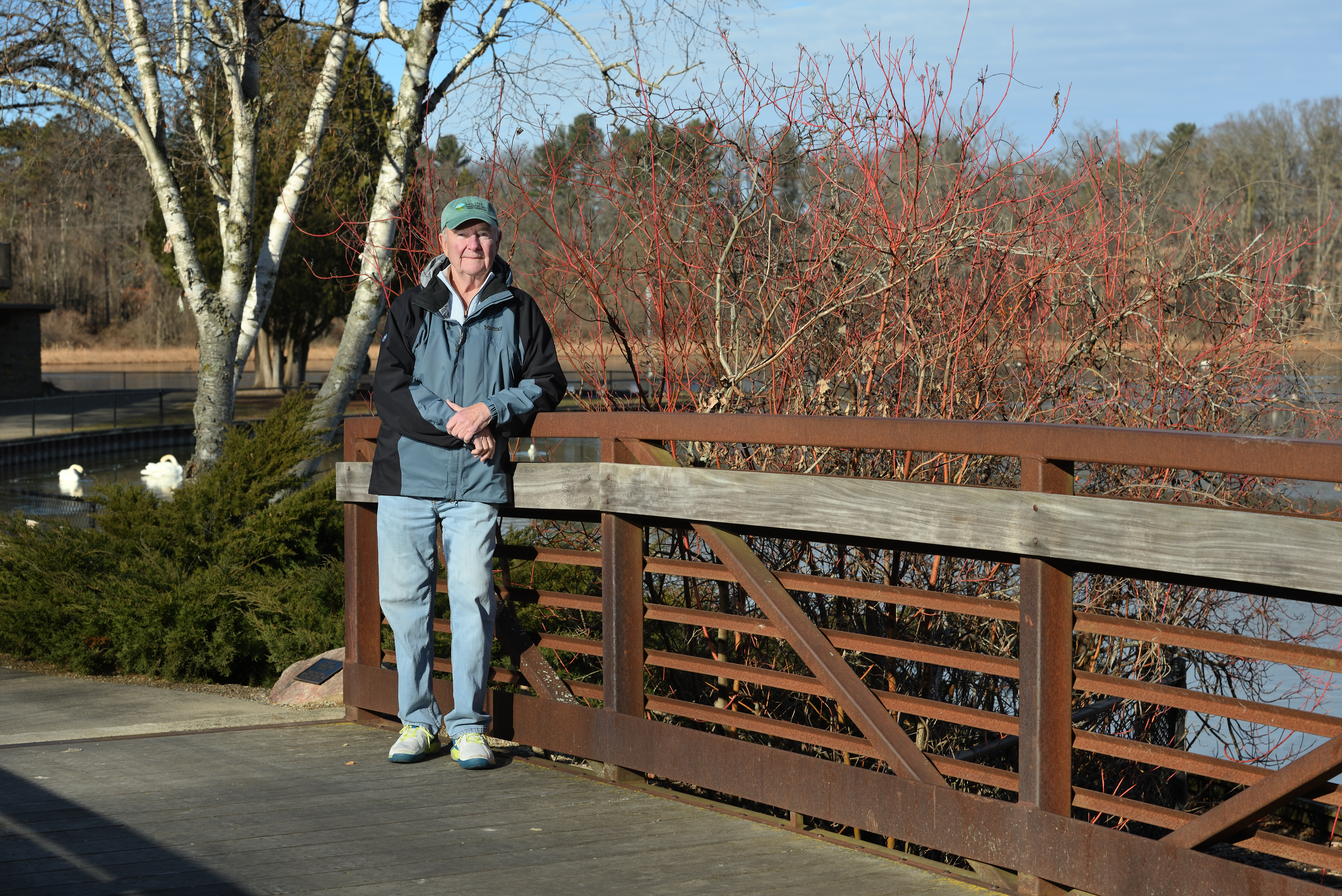 Dave stands on the KBS Bird Sanctuary bridge that he helped establish at Wintergreen Lake in honor of his brother, Thomas E. Dvorak.